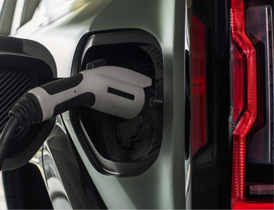 Close up of charging port with charger plugged in on a GMC Hummer EV SUV - Patriot GMC in HOPKINSVILLE KY