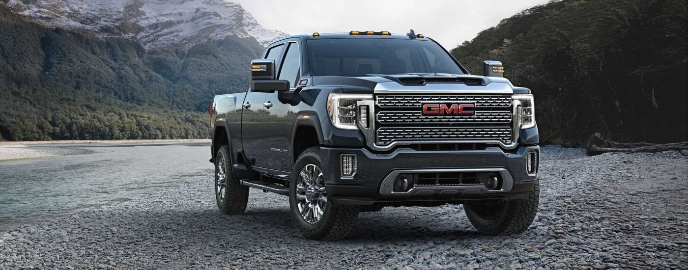 A black 2023 GMC Sierra 3500 Denali HD parked off-road