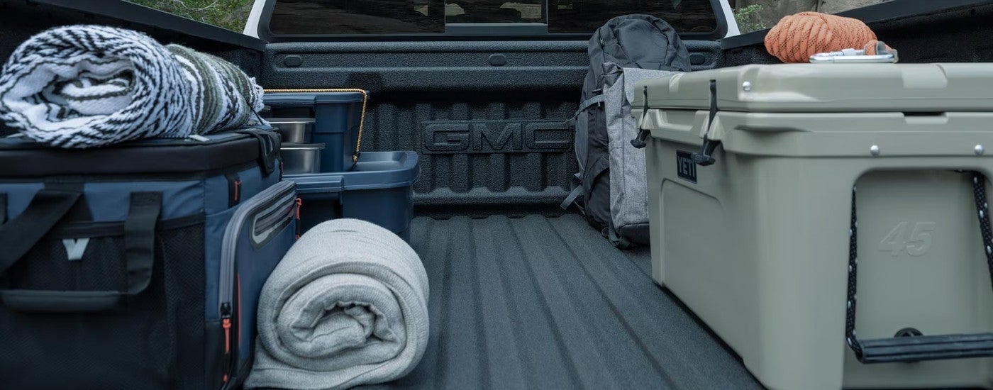 Camping gear in the bed of a 2026 GMC Canyon.